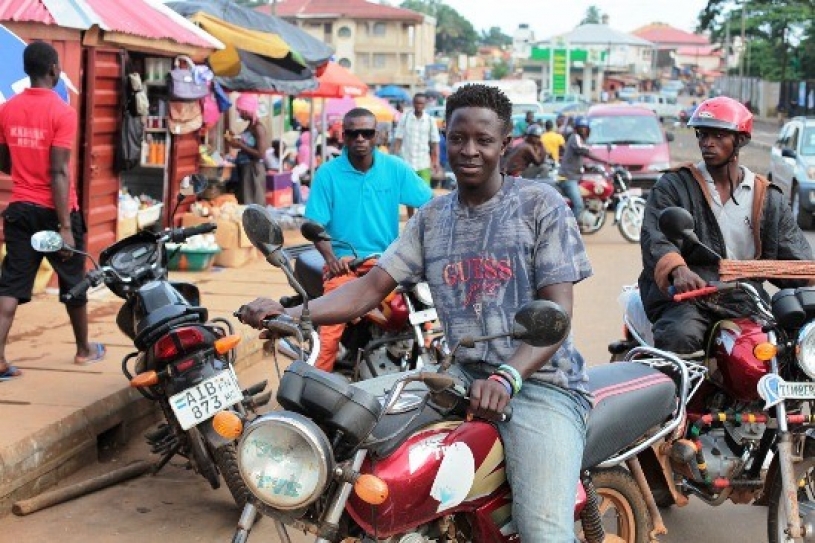 Bike riders reach out to people in a unique campaign against Ebola